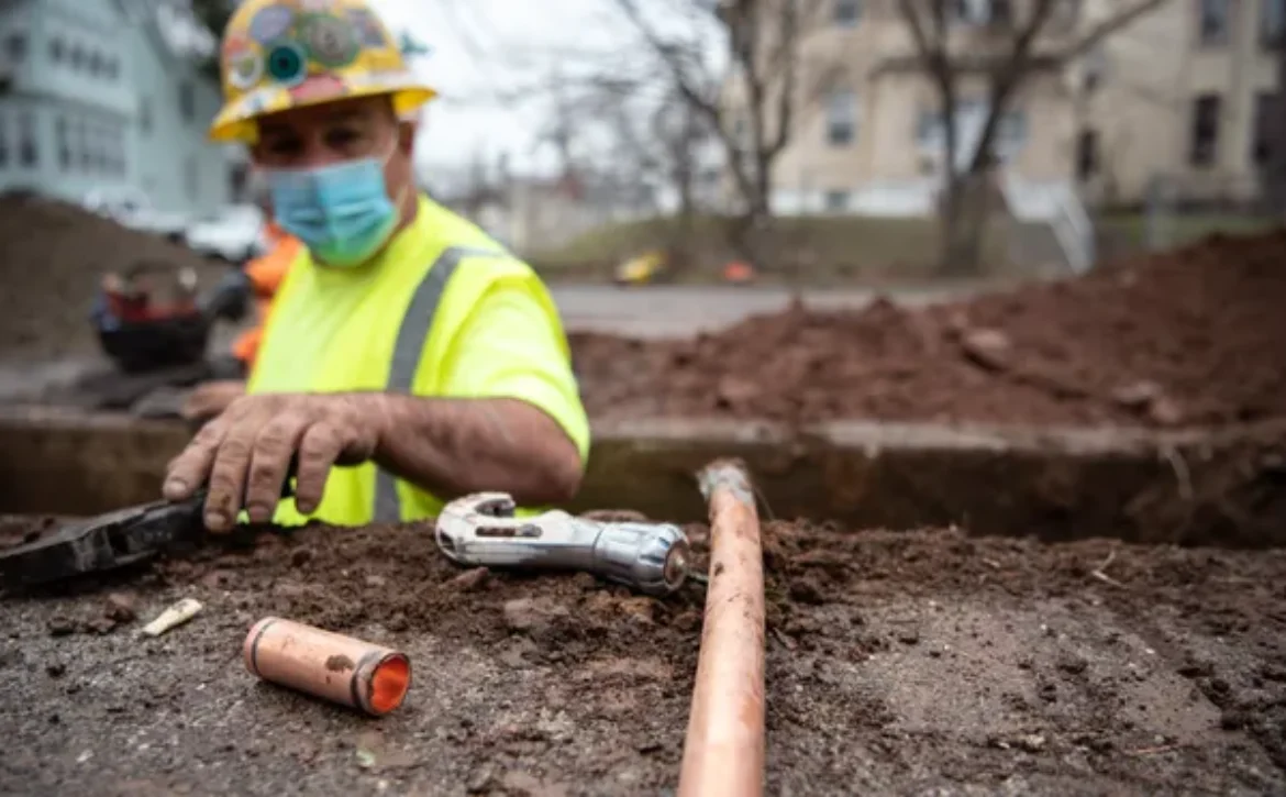 Replacing lead pipes at construction site