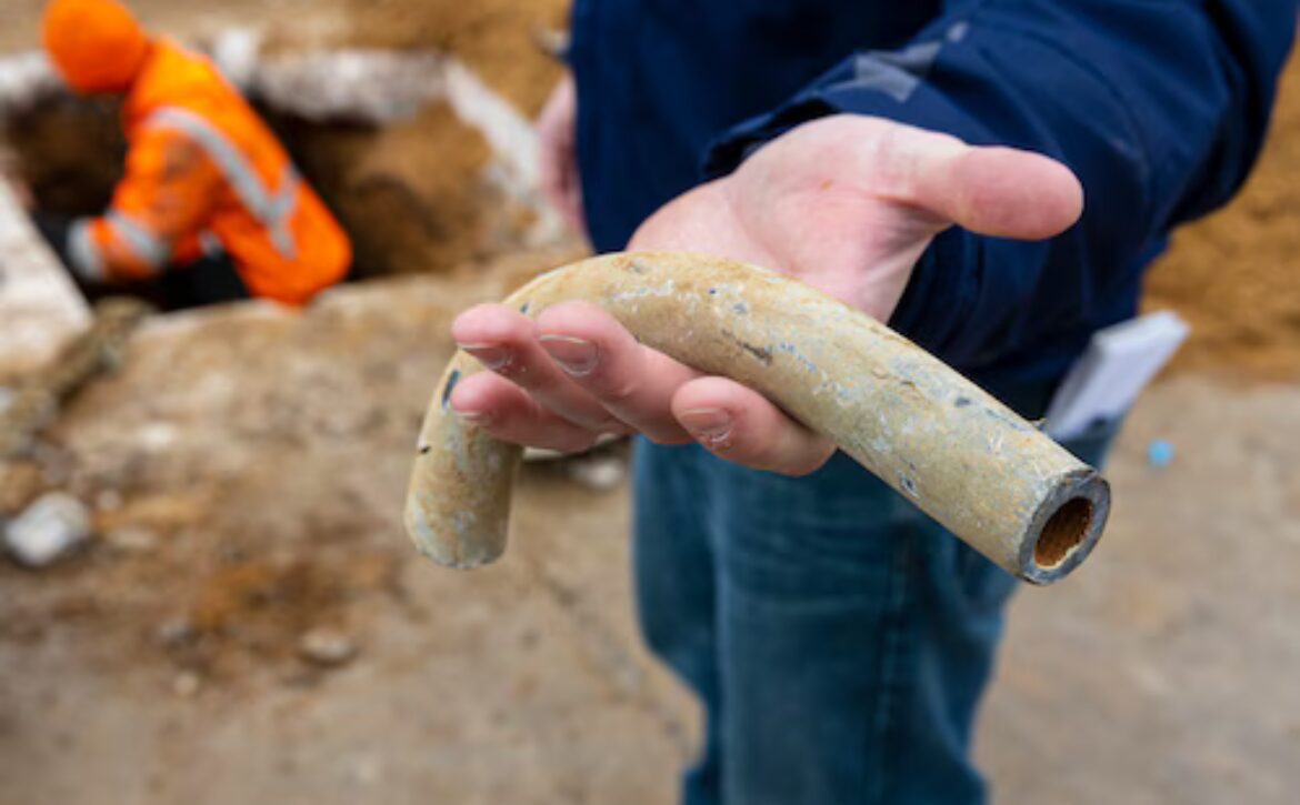 Man holding lead pipe
