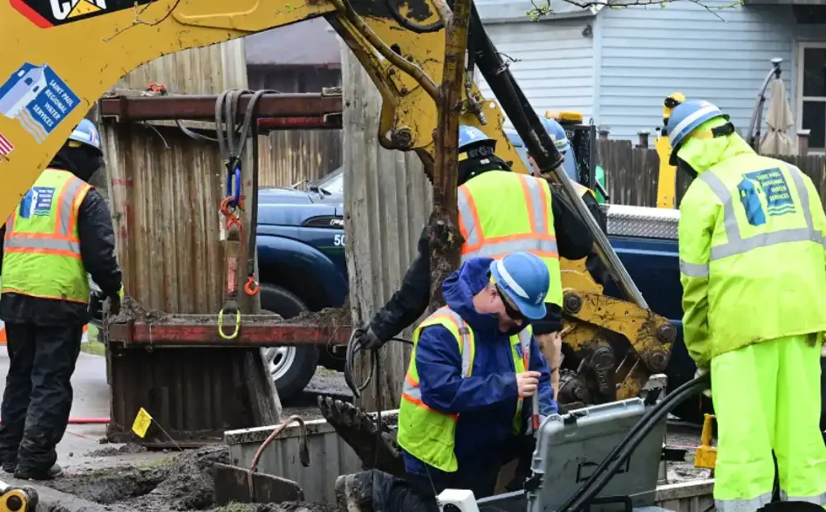 Construction workers in the street replacing lead service lines