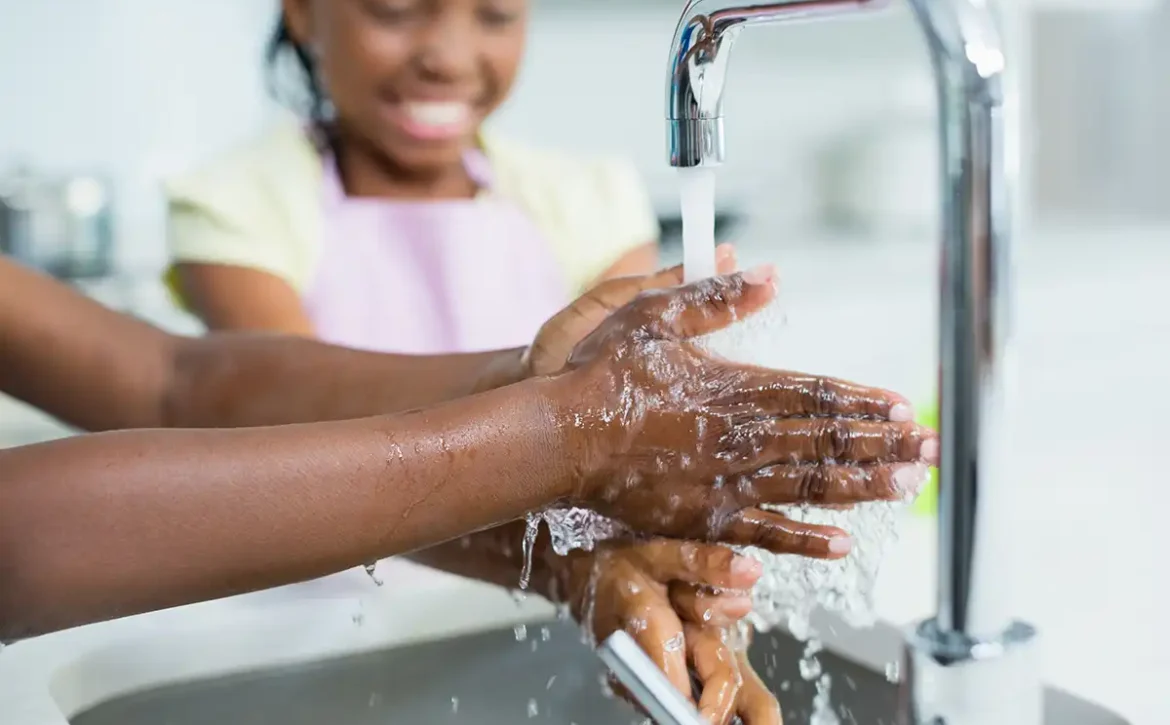 Washing hands in the sink