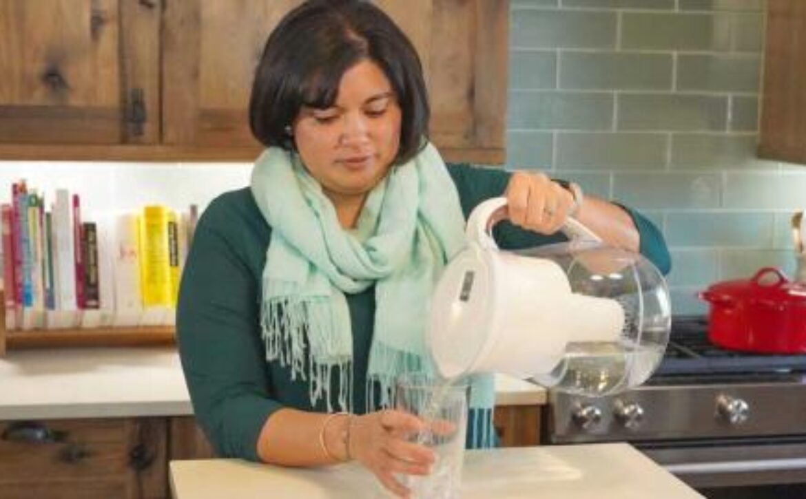 Woman pouring filtered water