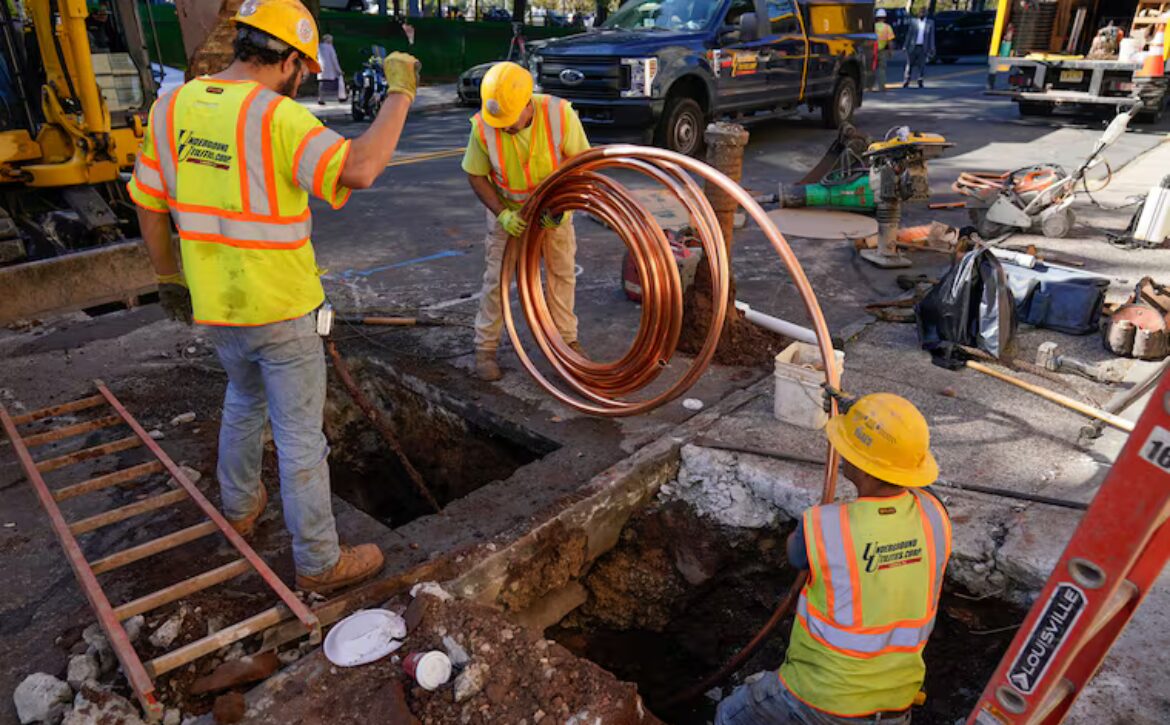 Workers replacing lead pipes