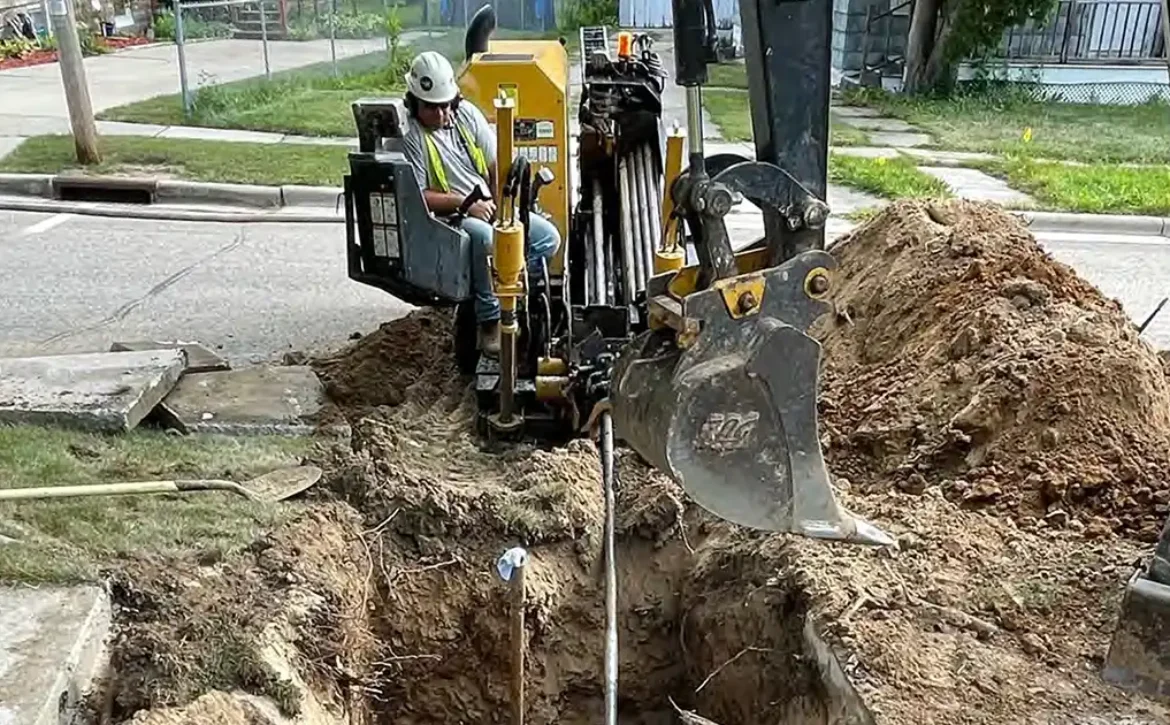Workers replacing lead pipes in a neighborhood