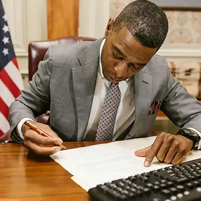 Mayor signing documents