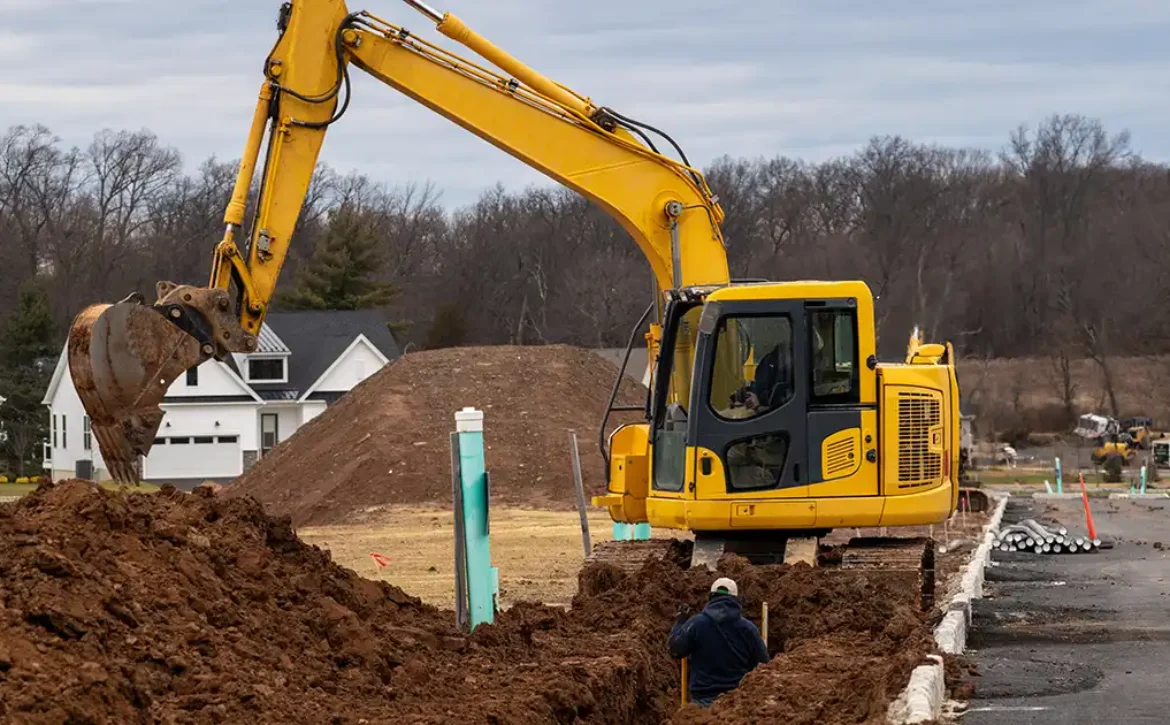 Excavator digging a water supply trench