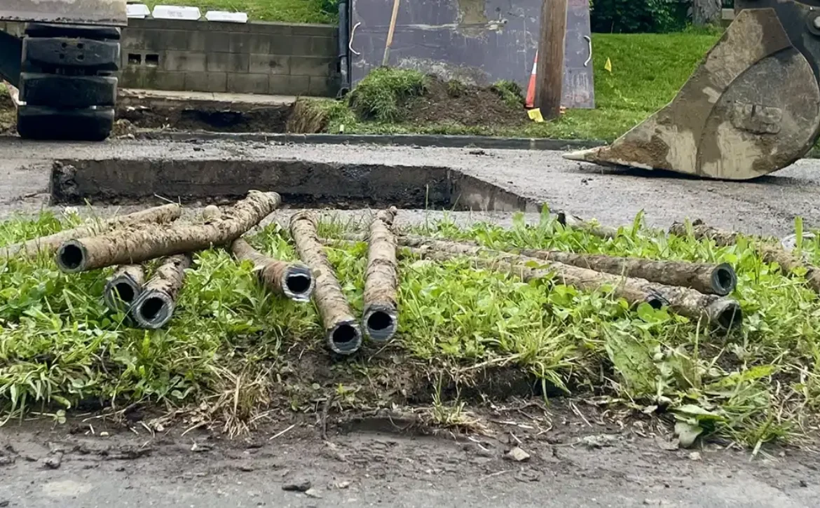 Lead pipes litter the ground in the Hilltop neighborhood following a city project to replace the pipes on April 29, 2026.