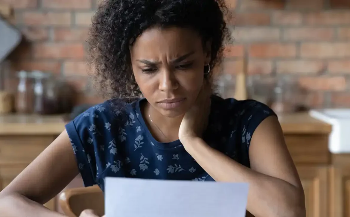 Woman looking at water bill